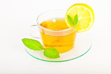 tea in cup with leaf mint and lemon