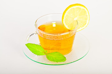 tea in cup with leaf mint and lemon