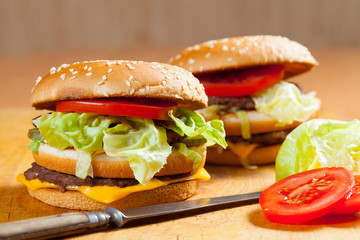 Delicious hamburgers on a wooden table