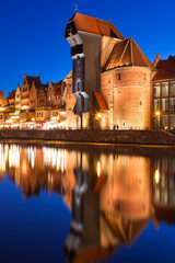 Fototapeta premium Old town of Gdansk with ancient crane at night, Poland