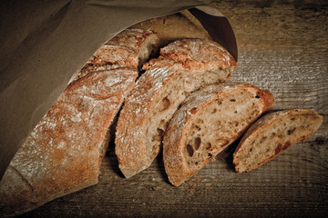 Freshly baked traditional bread on wooden table 