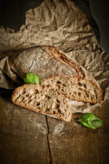 Freshly baked traditional bread on wooden table 