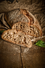 Freshly baked traditional bread on wooden table 