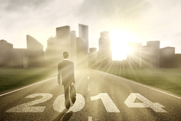 Businessman walking in the road