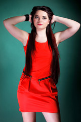 woman long hair red dress on green fashion