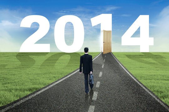 Businessman walks to the future in 2014