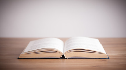 Open Book on wood background