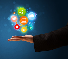 Multimedia icons in the hand of a businessman