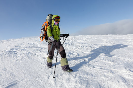 Hiker walking in winter Carpathian mountains