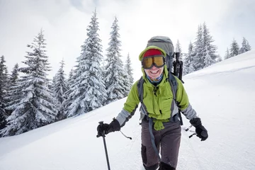 Wall murals Winter sports Hiker walking in winter Carpathian mountains