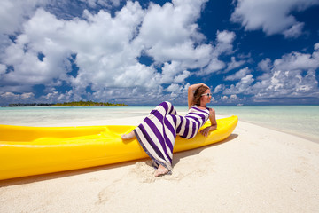 Caucasian woman rests at beautiful seashore