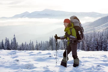 Acrylic prints Winter sports Hiker walking in winter Carpathian mountains