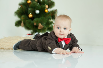 Small boy plays  in white studio