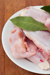 raw rabbit on white plate