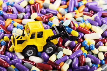 Industrial loader tractor toy load pills