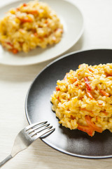 Fototapeta premium risotto with red pepper, healthy vegan food