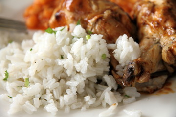 Chicken in tomato sauce with rice and beans