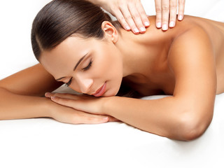 Massage. Close-up of a Beautiful Woman Getting Spa Treatment