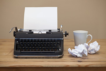 Old typrwriter and blank paper.