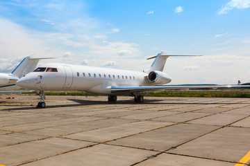 Fototapeta na wymiar white private jet on the platform
