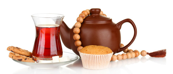 glass of Turkish tea and kettle isolated on white
