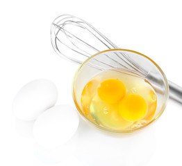 Corolla, flour and broken eggs isolated on white