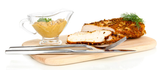 Roasted chicken fillets on wooden board, isolated on white