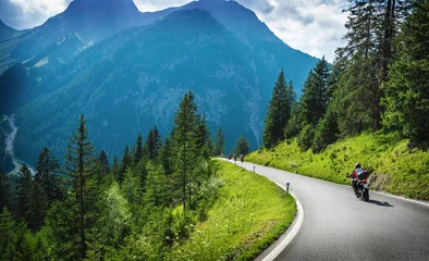 Plexiglas foto achterwand Motorcyclists in mountainous touring © Anna Om