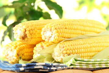 Crude corns on napkin on wooden table on window background