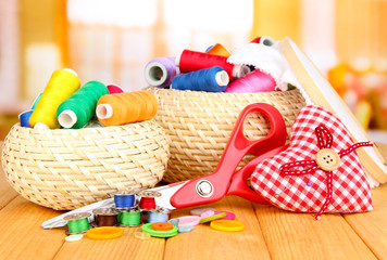 Fototapeta premium Wicker baskets with accessories for needlework