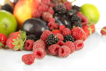 Assortment of juicy fruits and berries, isolated on white