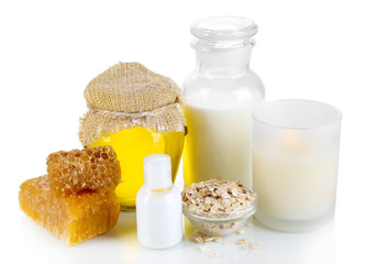 Honey and milk spa with oils and honey isolated on white