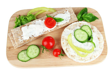 Tasty crispbreads with vegetables, isolated on white