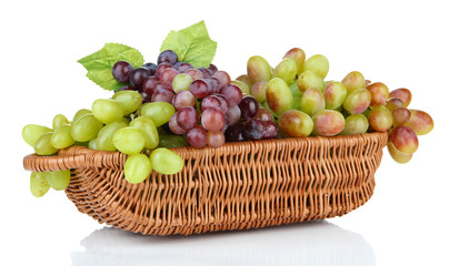 Fresh grape in wicker basket, isolated on white