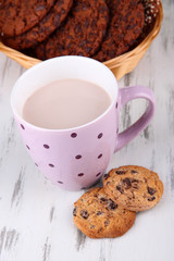 Cocoa drink and cookies on wooden background