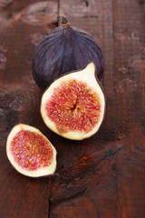 Ripe figs on wooden table close-up