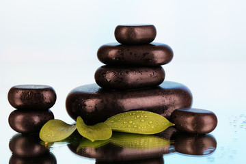 Spa stones on bright background
