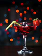 Tasty strawberry cocktail on bright background