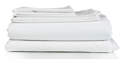 Stack of clean bedding sheets isolated on white