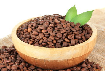 Coffee beans in bowl on white background
