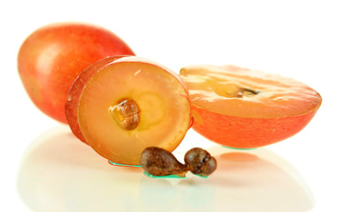 Ripe sliced grape and seeds, isolated on white