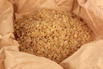 Brown sugar in paper close-up
