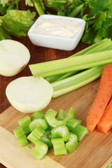 Fresh green celery with vegetables on table close-up