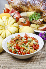 Bowl of fresh vegetable salad on jute table cloth. Selective foc