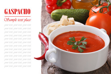 gazpacho soup with vegetables on the table isolated with text