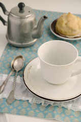 Teatime with eclair on lace napkin