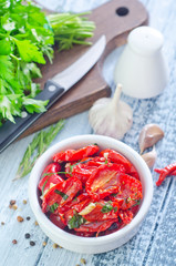 dry tomatoes with oil and basil