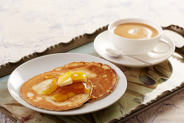 Pancakes with butter and caramel sauce