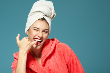 Cheerful attractive funny teen girl clean her teeth in the morni