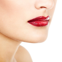 Fototapeta premium Beautiful lips of young gorgeous fresh woman with vivid red lips